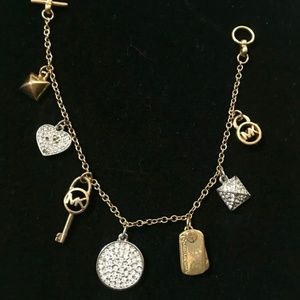 MK MICHAEL KORS GORGEOUS BRACELET MULTI CHARM SAYS MK TOGGLE CLOSURE GOLDTONE